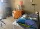Small bedroom with dresser and twin bed at 115 112Th Ne Ave # 605, St Petersburg, FL 33716