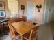 Small dining area with wooden table and chairs at 115 112Th Ne Ave # 605, St Petersburg, FL 33716