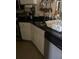 Kitchen with white cabinets and granite countertops at 115 112Th Ne Ave # 605, St Petersburg, FL 33716