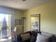 Living room with sofa and access to balcony at 115 112Th Ne Ave # 605, St Petersburg, FL 33716