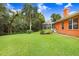 Orange house exterior with well-manicured lawn at 239 147Th Ne St, Bradenton, FL 34212