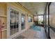 Bright screened porch with tiled floor and access to backyard at 3602 Pine Knot Dr, Valrico, FL 33596