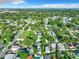 Wide aerial shot of a neighborhood showcasing the density of homes among mature trees at 3128 17Th N St, St Petersburg, FL 33713