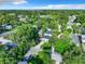 Scenic aerial view of a suburban home surrounded by lush green trees and well-maintained lawns at 3128 17Th N St, St Petersburg, FL 33713