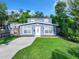 Charming two-story home boasts a well-manicured lawn and freshly painted exterior at 3128 17Th N St, St Petersburg, FL 33713