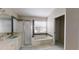 Bathroom features a large tub and a separate shower at 3464 Silverstone Ct, Plant City, FL 33566