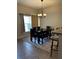 Spacious dining room with a large table and bench seating at 3464 Silverstone Ct, Plant City, FL 33566