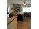 Kitchen with stone backsplash, island, and dishwasher at 3464 Silverstone Ct, Plant City, FL 33566