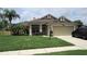 Single story home with attached garage and manicured lawn at 3464 Silverstone Ct, Plant City, FL 33566