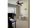 Bedroom with a desk, chair, and guitar at 3464 Silverstone Ct, Plant City, FL 33566