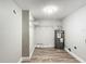Laundry room with shelving, water heater, and vinyl flooring at 3128 17Th N St, St Petersburg, FL 33713