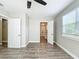 Bedroom with ensuite bathroom and wood-look floors at 3128 17Th N St, St Petersburg, FL 33713