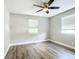 Bright bedroom featuring wood-look floors and ceiling fan at 3128 17Th N St, St Petersburg, FL 33713