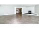 Living room with fireplace, hardwood floors, and view to kitchen at 3128 17Th N St, St Petersburg, FL 33713