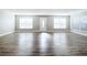 Large living room with hardwood floors and multiple windows at 3128 17Th N St, St Petersburg, FL 33713