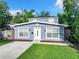 A charming two-story home featuring a newly painted exterior and a fresh front yard at 3128 17Th N St, St Petersburg, FL 33713