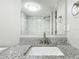 Renovated bathroom featuring granite countertop vanity and a tiled shower at 3128 17Th N St, St Petersburg, FL 33713