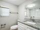 Clean bathroom with granite vanity, white cabinets and a tiled shower at 3128 17Th N St, St Petersburg, FL 33713