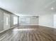 Living room with hardwood floors and an exterior door at 3128 17Th N St, St Petersburg, FL 33713