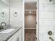 Updated bathroom with granite vanity, white sink, and marble tile shower at 3128 17Th N St, St Petersburg, FL 33713