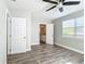 Bedroom with ensuite bathroom and wood-look floors at 3128 17Th N St, St Petersburg, FL 33713