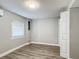 Simple bedroom with grey walls, wood-look floors, and a large closet at 3128 17Th N St, St Petersburg, FL 33713