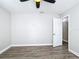 Spacious bedroom with ceiling fan and door to hallway at 3128 17Th N St, St Petersburg, FL 33713