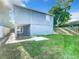 House with backyard, covered patio, and wooden fence at 3128 17Th N St, St Petersburg, FL 33713