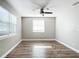 Bright bedroom with wood-look floors and window blinds at 3128 17Th N St, St Petersburg, FL 33713