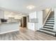 Bright kitchen boasts granite countertops, white cabinets and stainless steel appliances at 3128 17Th N St, St Petersburg, FL 33713