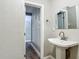 Simple bathroom with pedestal sink and built-in closet at 3128 17Th N St, St Petersburg, FL 33713