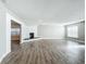 Open living room showcasing a stone fireplace and hardwood floors at 3128 17Th N St, St Petersburg, FL 33713