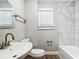 Clean bathroom with white pedestal sink and bathtub at 3128 17Th N St, St Petersburg, FL 33713