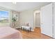 Bright bedroom featuring hardwood floors and a walk-in closet at 2847 Tarragona Way, Wesley Chapel, FL 33543