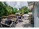 Cozy outdoor deck space with grill and modern chairs create the perfect relaxation spot at 1203 E 33Rd Ave, Tampa, FL 33603