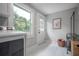 Clean and bright laundry room featuring a large window and modern washer and dryer at 1203 E 33Rd Ave, Tampa, FL 33603