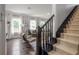 Cozy living room showcasing hardwood floors, stylish furniture, and a staircase at 1203 E 33Rd Ave, Tampa, FL 33603