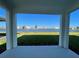 Covered patio overlooking a lake with a fountain and other homes at 18207 Fattoria Ter, Lakewood Ranch, FL 34211