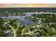 Beautiful aerial image showcases waterfront properties with docks on a serene lake in a residential neighborhood at 3744 E Lake Dr, Land O Lakes, FL 34639