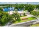Home with solar panels, and mature tree coverage; sits lakeside at 3744 E Lake Dr, Land O Lakes, FL 34639