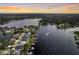 Expansive lakefront living with a long view of waterway and properties with private boat docks in aerial shot at 3744 E Lake Dr, Land O Lakes, FL 34639