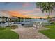 Backyard patio featuring a dock and serene water view at 3744 E Lake Dr, Land O Lakes, FL 34639