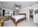 Relaxing bedroom features neutral tones, large windows and a convenient en-suite bathroom at 3744 E Lake Dr, Land O Lakes, FL 34639