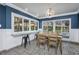 Charming dining area features lake views, tile flooring, and a bar seating area by the window at 3744 E Lake Dr, Land O Lakes, FL 34639