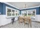 Bright dining area with views of the pool and lake at 3744 E Lake Dr, Land O Lakes, FL 34639