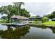 A private dock with boat lift offers direct access to the serene lake at 3744 E Lake Dr, Land O Lakes, FL 34639
