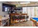 Entertainment room with custom bar, TV, and pool table, perfect for hosting at 3744 E Lake Dr, Land O Lakes, FL 34639