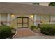 Welcoming front entrance featuring a covered porch and a beautifully landscaped walkway at 3744 E Lake Dr, Land O Lakes, FL 34639