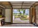 Spacious garage with brick flooring and access to the backyard at 3744 E Lake Dr, Land O Lakes, FL 34639