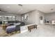Bright living room with a comfortable sectional sofa, and large windows at 3744 E Lake Dr, Land O Lakes, FL 34639
